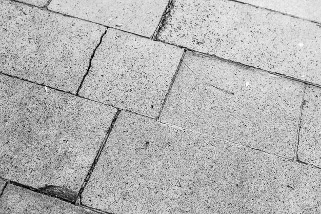 Fond de texture de chaussée en pierre de brique grise