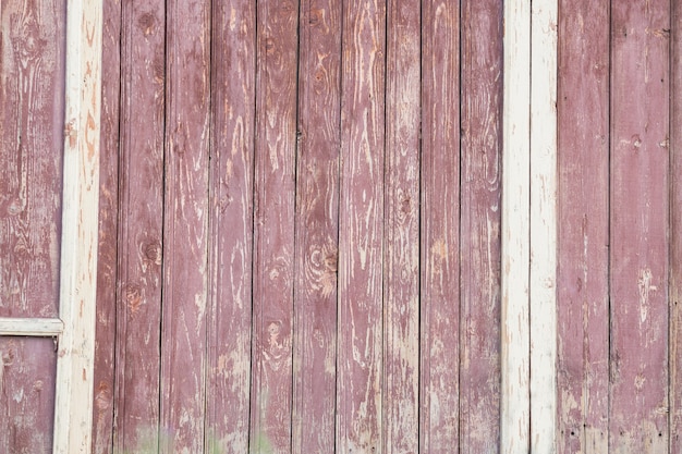 Fond de texture de clôture ancienne rouge en bois