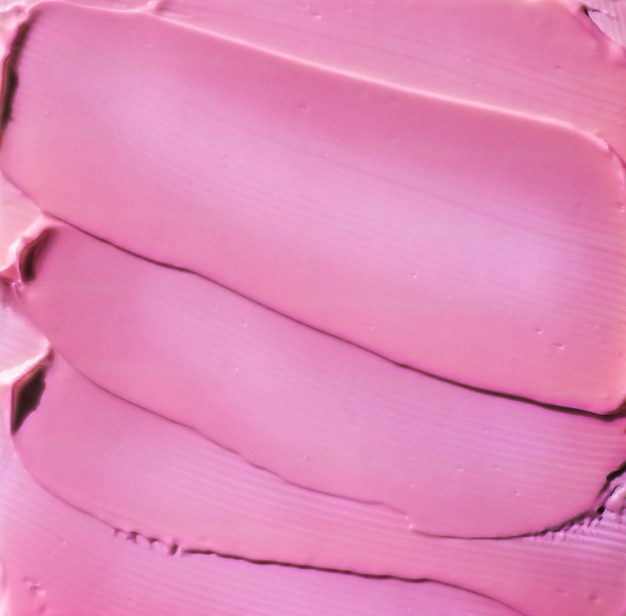 Fond de texture cosmétique rose maquillage et soins de la peau produit cosmétique crème rouge à lèvres hydratant macro comme conception de flatlay de vacances de marque de beauté de luxe