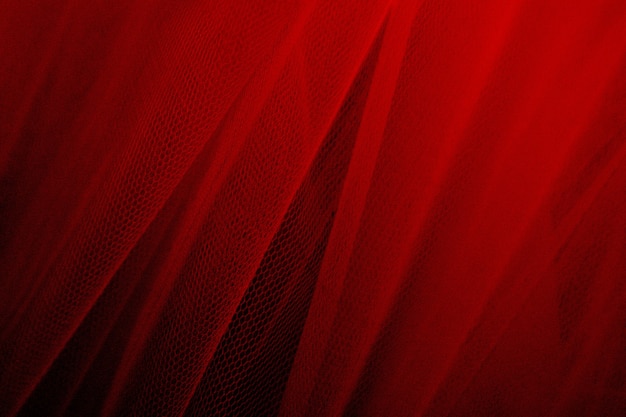 Fond texturé drapé en tulle rouge