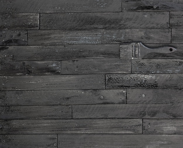 fond et texture du mur de grange en bois noir décoratif