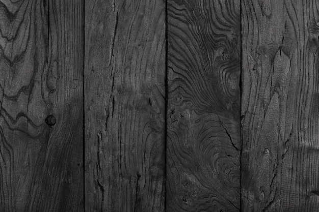 fond et texture du mur de grange en bois noir décoratif