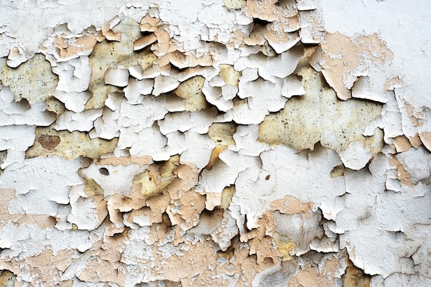 Fond de texture fissuré plâtre de peinture écaillée.