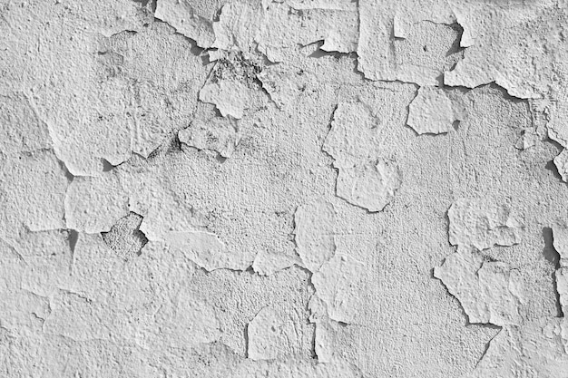 Fond de texture fissuré plâtre de peinture écaillée.