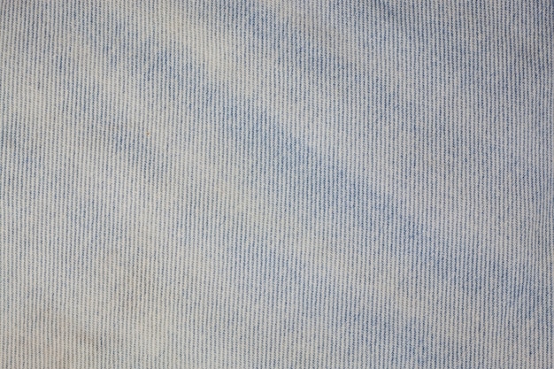 Photo fond de texture de jeans en denim bleu.