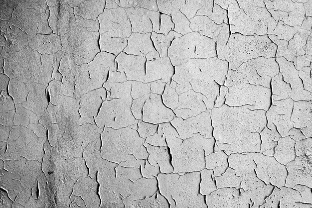 fond de texture de mur en béton. Fragment de mur avec des rayures et des fissures