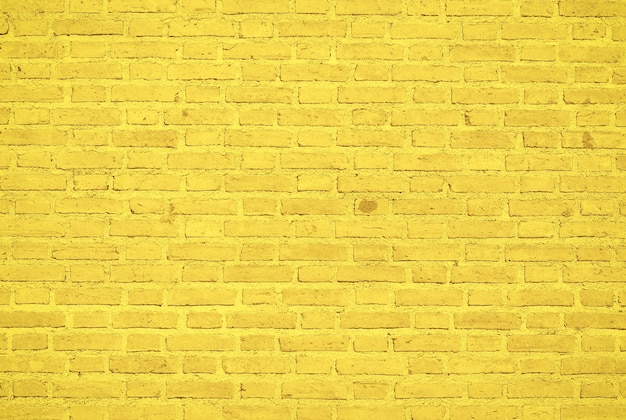 Photo fond de texture de mur de brique jaune