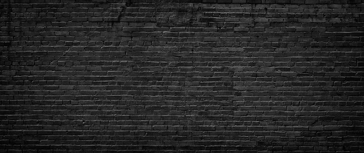 Photo fond texturé de mur de brique noire