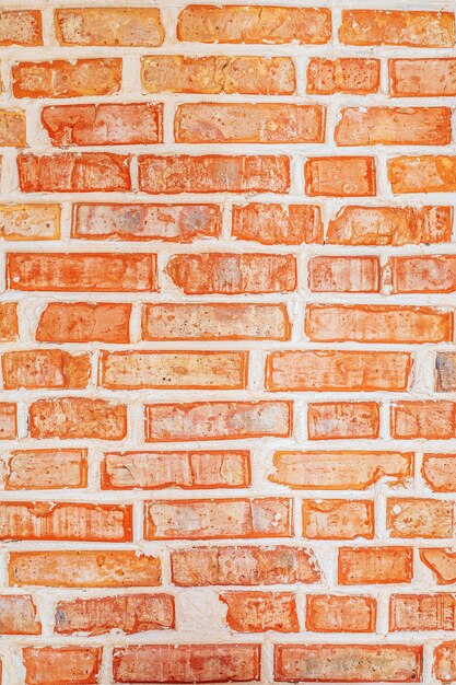 Fond de texture de mur de briques loft sablé orange vif et riche