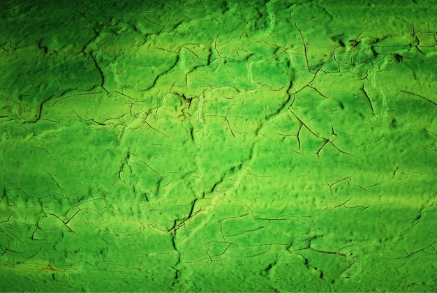 Fond de texture de mur peint fissuré vert