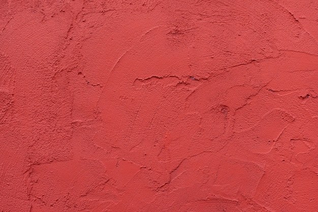 Fond texturé de mur rouge