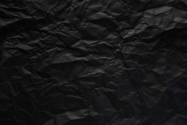 Fond de texture de papier froissé noir.