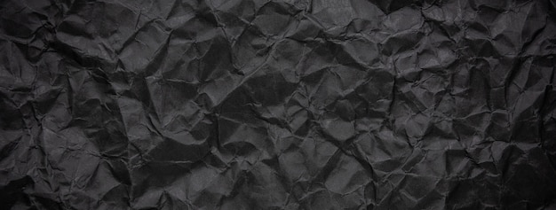 Fond de texture de papier noir foncé chiffonné