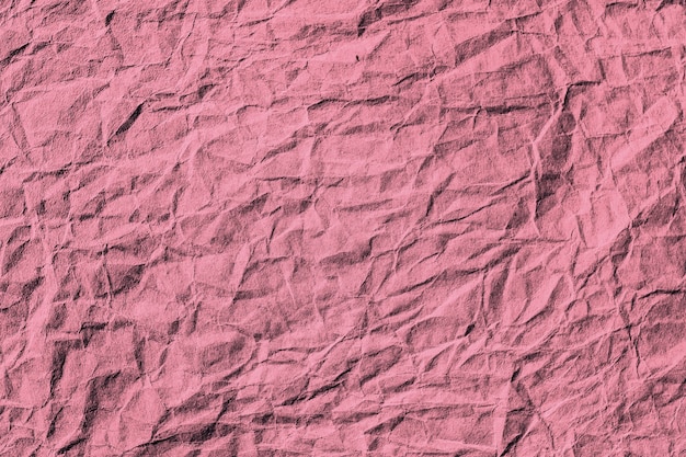 Fond texturé de papier rose rouge froissé