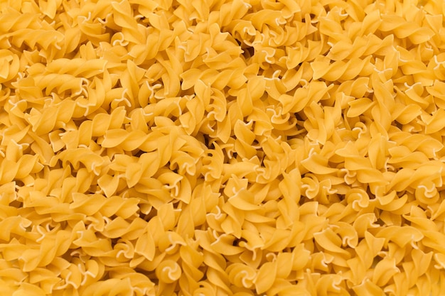 Fond de texture de pâtes fusilli non cuites