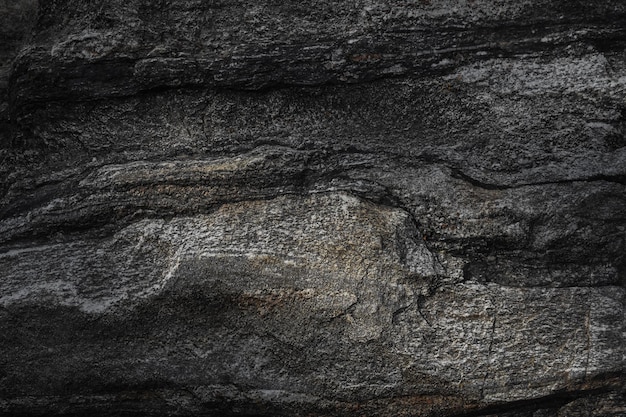 Fond de texture de pierre ardoise noire gris foncé.