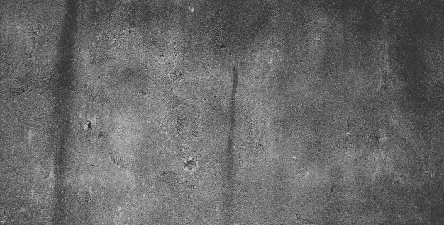 Fond de texture de pierre granuleuse noire ou fond texturé gris foncé