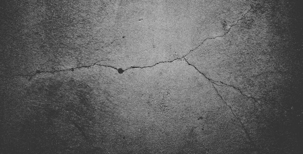 Fond de texture de pierre granuleuse noire ou fond texturé gris foncé