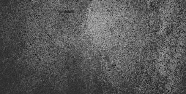 Fond de texture de pierre granuleuse noire ou fond texturé gris foncé