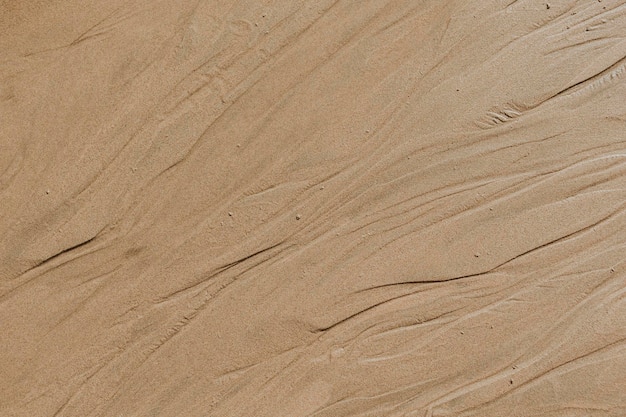 Fond texturé de plage de sable beige