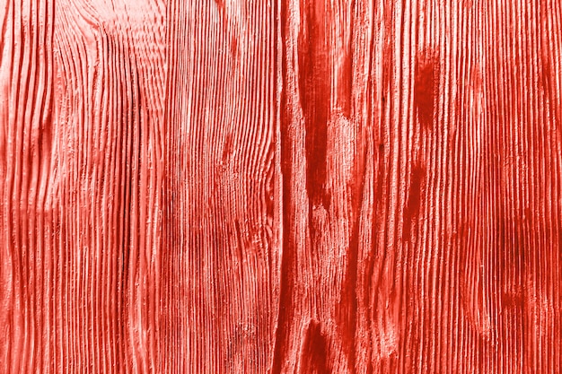 Fond de texture rugueuse de couleur corail en bois