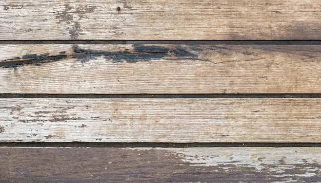 Fond de texture rugueuse de table en bois de planche brune