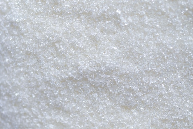 Fond de texture de sucre sucre blanc pour la nourriture et les bonbons dessert tas de bonbons de sucre sucré granulé cristallin