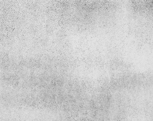 Fond de texture de surface en béton inégal gris grunge avec des taches noires