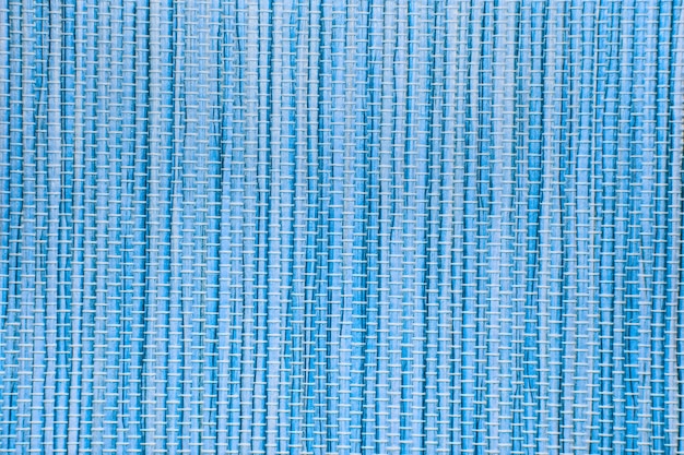 Le fond de texture de tapis de papier bleu peut être utilisé pour le rideau vertical