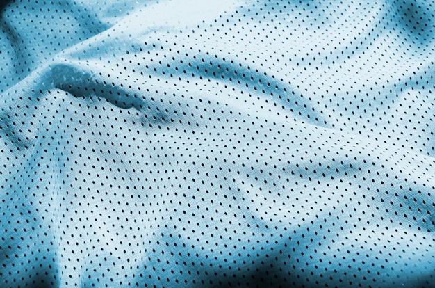 Fond de texture tissu bleu sport vêtements. Vue de dessus de la surface textile en tissu bleu clair. Maillot de basket brillant. Espace texte