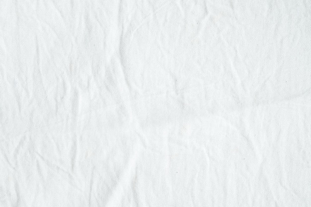 Photo fond de texture de tissu de coton blanc froissé, papier peint
