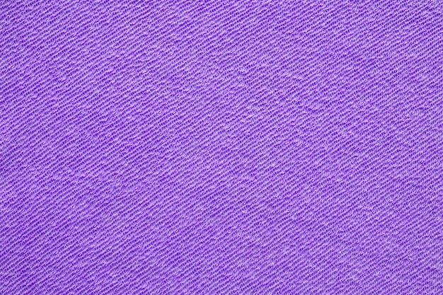 Fond texturé de tissu de coton violet