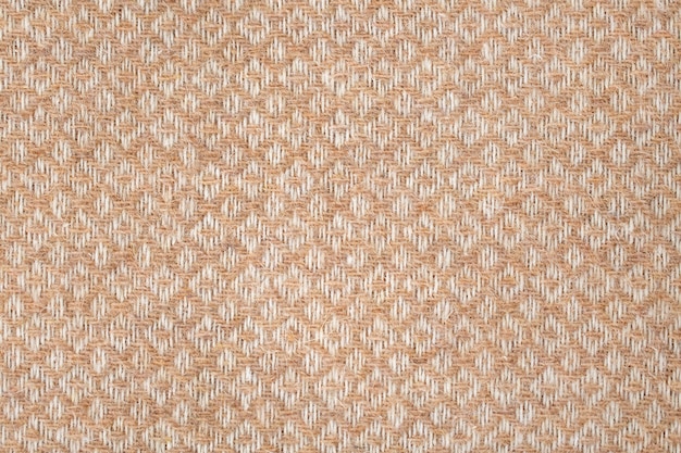 Fond texturé en tissu de laine géométrique marron et blanc, texture motif tissé à la machine. Couvre-lit léger ou gros plan