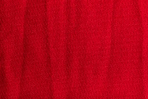 Fond Texturé En Tissu De Laine Rouge. Surface Froissée.