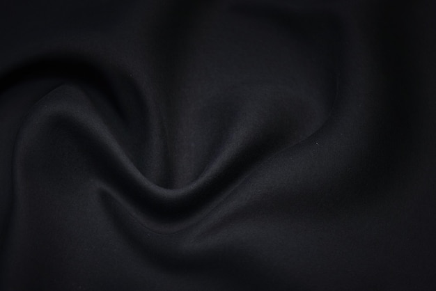 Fond de texture de tissu noir. Textile et matériel de chemise de luxe vierge.