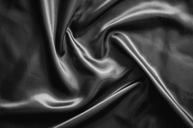 Fond de texture de tissu de satin noir ridée