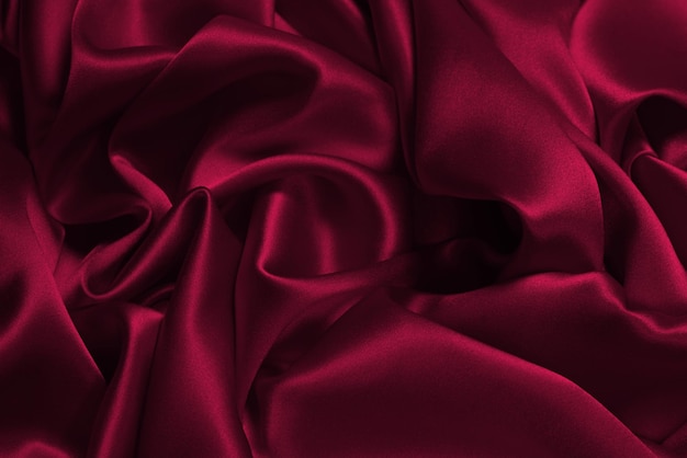 Fond de texture de tissu de soie magenta viva riche et luxueux