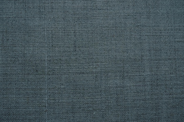 Fond de texture de tissu tissu gris foncé avec tissage aspect naturel légèrement froissé du matériau