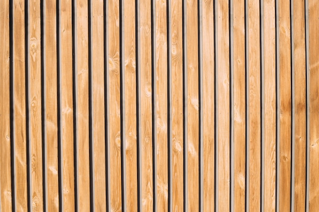 Fond et texture de vieux bois décoratif rayé sur le mur de surface