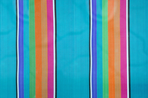 Fond de tissu rayé coloré, texture de la chaise de plage pliante