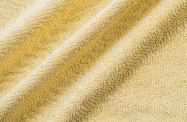 Fond de tissu serviette jaune froissé CloseUp