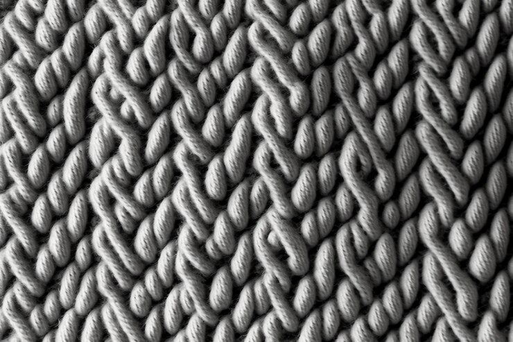 Photo fond de tissu en tricot de laine gris clair tacheté sans couture.