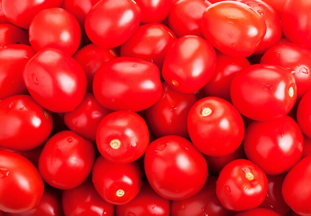 Fond de tomates rouges mûres pour votre conception