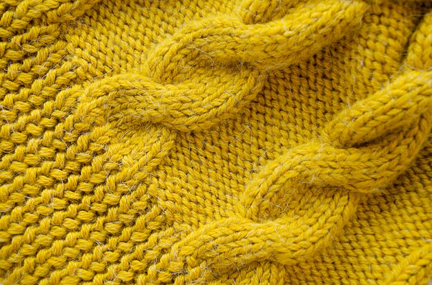 Fond tricoté. Texture tricotée. Tricot de laine.