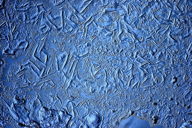 fond de verre de glace bleu, texture abstraite de la surface de la glace sur le verre, eau saisonnière gelée