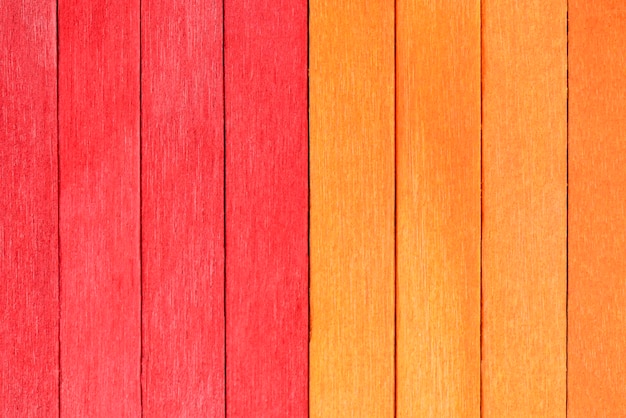 Fond vif de planches de bois orange et rouge