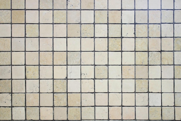 Forme carrée de mosaïque en céramique beige Arrière-plan de carreaux de céramique Carreau de céramique avec coutures grises