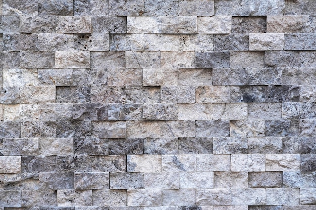 Fragment d'un mur d'une pierre taillée