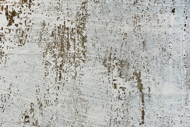 Fragment de mur avec des rayures et des fissures