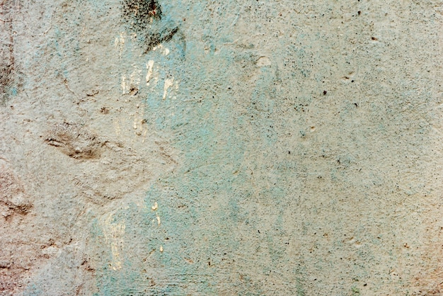 Fragment de mur avec des rayures et des fissures